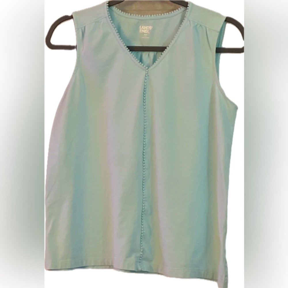 Sleeveless seafoam petite top with trim, feminine details, and v-neck